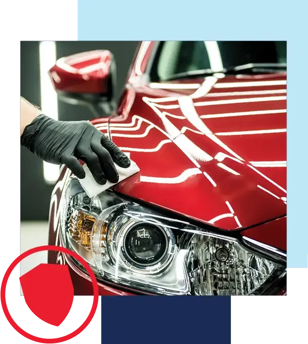 Holiday VIP has you covered. Image of collision center technician wiping the hood of a red vehicle.